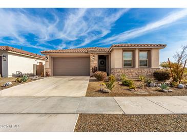 Single-story home with desert landscaping and a two-car garage at 15047 S 178Th Dr, Goodyear, AZ 85338