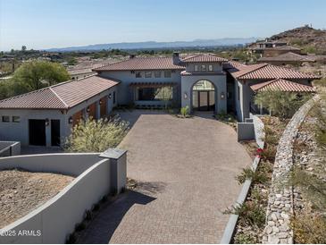 Wide angle aerial shot of a luxury home with desert landscaping and a circular driveway at 6825 N 39Th Pl, Paradise Valley, AZ 85253