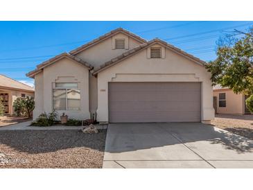 Single-story house with a two-car garage and desert landscaping at 1085 W Dava Dr, Tempe, AZ 85283