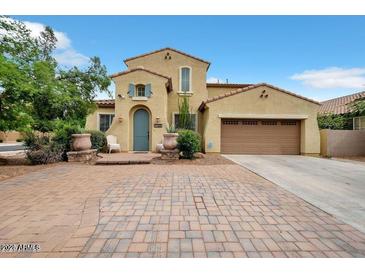 Two-story house with a brick driveway and landscaping at 1188 W Laredo Ave, Gilbert, AZ 85233