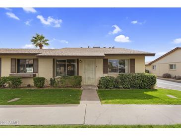 Charming home featuring a well-manicured lawn, desert landscaping, and a welcoming front entrance at 2442 N 22Nd Ave, Phoenix, AZ 85009