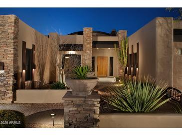 Stunning desert home with stone accents and mature landscaping at 28492 N 95Th Pl, Scottsdale, AZ 85262