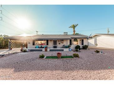 Charming single-story home with landscaped front yard at 410 N 56Th Pl, Mesa, AZ 85205