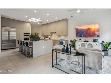 Open-concept area with a stylish kitchen featuring a large island and a comfortable living space at 7705 E Doubletree Ranch Rd # 56, Scottsdale, AZ 85258