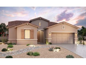 Single-story home with desert landscaping, two-car garage, and light-colored stucco at 20047 W San Juan W Ave, Litchfield Park, AZ 85340
