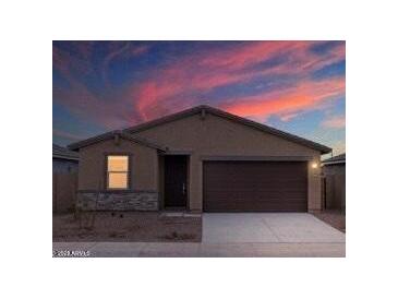 One-story house with a two-car garage and a neutral color palette at 3353 E Alexander Dr, San Tan Valley, AZ 85143