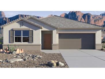 Charming single-story home with a two car garage and desert landscaping at 8470 W Mantle Way, Florence, AZ 85132