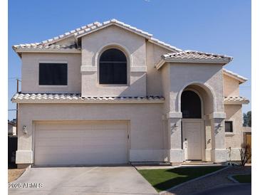 Two-story house with a large garage and well-maintained lawn at 1425 S Lindsay Rd # 20, Mesa, AZ 85204