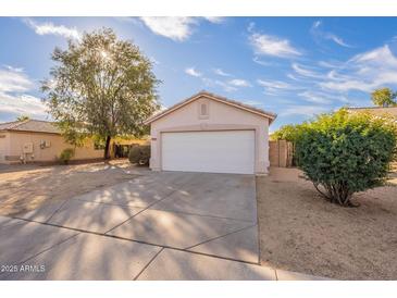 House exterior featuring a garage and well-maintained front yard at 15145 W Elko Dr, Surprise, AZ 85374