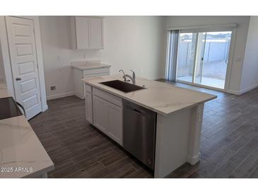 Modern kitchen with island, stainless steel appliances, and white cabinets at 18864 E Bruno Dr, Gold Canyon, AZ 85118