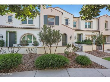 Attractive 2-story townhome with a landscaped front yard and gated entry at 2477 W Market Pl # 55, Chandler, AZ 85248