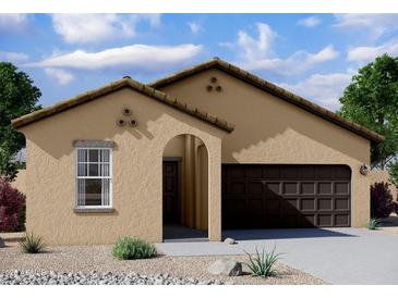 Tan house with brown garage door, arched entryway, and desert landscaping at 38123 N Stallion St, San Tan Valley, AZ 85140