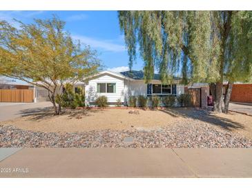 Charming single story home with a landscaped front yard at 8344 E Indianola Ave, Scottsdale, AZ 85251