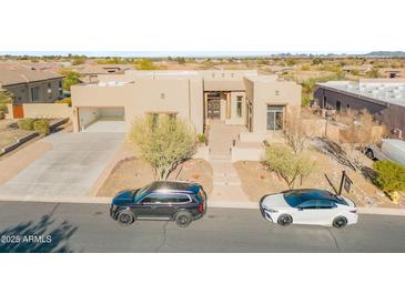 Stunning single-Gathering home showcasing a desert landscape and neutral earth-tone stucco exterior at 8606 S 30Th St, Phoenix, AZ 85042