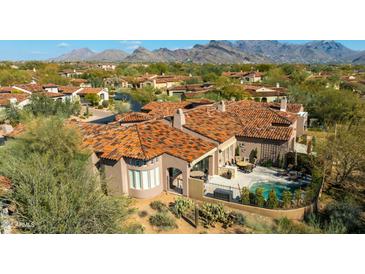 Stunning home featuring a private pool, patio area, and mountain views at 8923 E Mountain Spring Rd, Scottsdale, AZ 85255