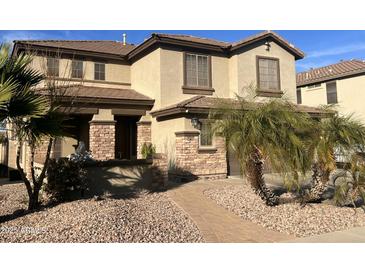 Two-story house with stone accents and landscaping at 11340 E Stearn Ave, Mesa, AZ 85212