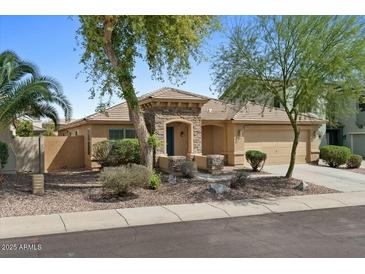 Charming single-story home featuring desert landscaping and a private 2-car garage, ideal for comfortable living at 17750 W Watson Ln, Surprise, AZ 85388