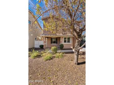 Two-story home with a landscaped yard and neutral exterior at 2241 S Wallrade Ln, Gilbert, AZ 85295