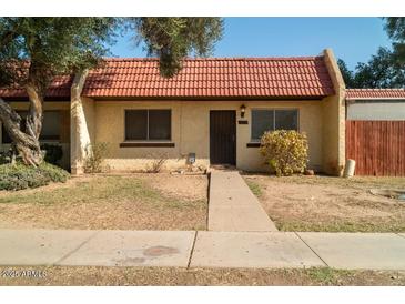 Cute updated condo with a charming front yard and walkway at 3331 W Del Monico Ln, Phoenix, AZ 85051