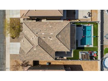 Property features a large backyard with a pool and spacious layout at 38100 W Santa Clara Ave, Maricopa, AZ 85138