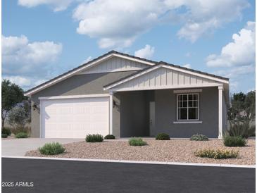 Single-story home with a two-car garage and attractive landscaping at 4509 S 95Th Dr, Tolleson, AZ 85353