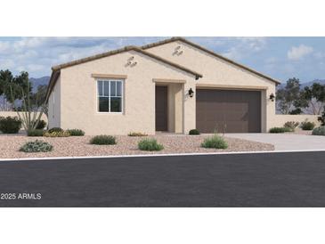 Single-story home with a two-car garage and desert landscaping at 4517 S 95Th Dr, Tolleson, AZ 85353