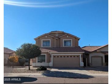 Charming two-story home featuring neutral tones and a well-maintained front yard at 7712 S 25Th Ave, Phoenix, AZ 85041