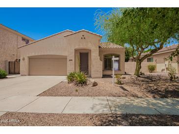 Charming single-story home with desert landscaping, a two-car garage, and a welcoming front entrance at 4286 E Buckboard Rd, Gilbert, AZ 85297