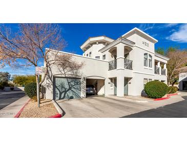 Elegant stucco home with a private garage and balcony offers modern living and beautiful architectural details at 295 N Rural Rd # 259, Chandler, AZ 85226