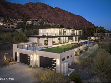 Stunning modern home featuring a rooftop deck, putting green, pool, and mountain views at 4725 N 56Th St, Phoenix, AZ 85018