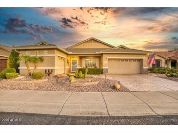 Charming single-story home with desert landscaping and a two-car garage at 17675 N Coconino Dr, Surprise, AZ 85374