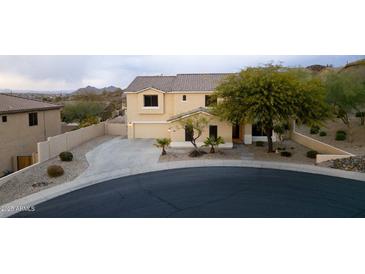 Charming two-story home with a three-car garage and well-manicured front yard landscape at 6206 W Buckhorn Trl, Phoenix, AZ 85083