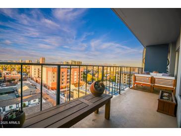 Balcony seating offers city views with blue skies at 805 N 4Th Ave # 903, Phoenix, AZ 85003