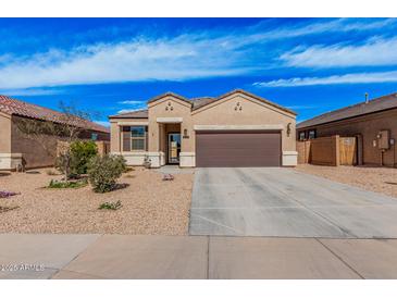 Charming single-story home featuring a two-car garage, neutral stucco, and low maintenance desert landscaping at 1250 E Eric Pl, Casa Grande, AZ 85122