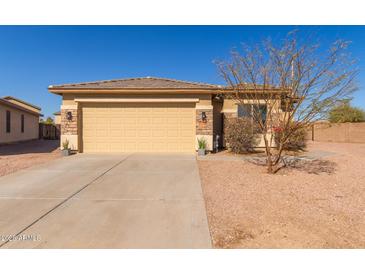 Charming single-story home featuring a two-car garage and desert landscaping at 35344 N Karan Swiss Cir, San Tan Valley, AZ 85143