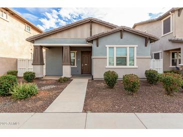 Inviting single-Gathering home with a covered entry, neutral paint scheme, and tidy landscaping at 3868 E Robert St, Gilbert, AZ 85295