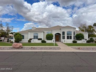 Stunning single-story home with manicured landscaping and a welcoming entrance at 2251 N 32Nd St # 21, Mesa, AZ 85213