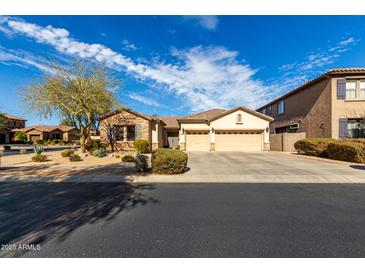 Charming single-story home featuring a three-car garage and desert landscaping at 2422 W Aloe Vera Dr, Phoenix, AZ 85085