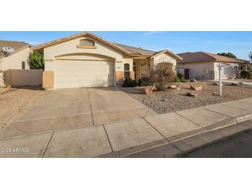 Charming single-story home with a well-maintained front yard and attached two-car garage at 6516 W Matilda Ln, Glendale, AZ 85308