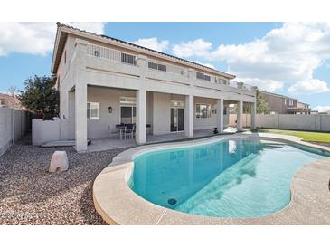 Inviting backyard with a refreshing pool, perfect for relaxation and outdoor gatherings at 7318 W Paso Trl, Peoria, AZ 85383