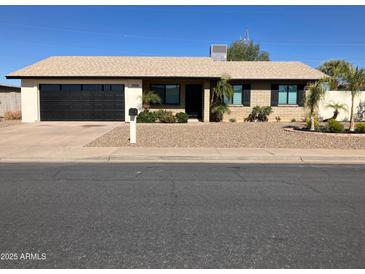 Charming home exterior with a well-manicured yard at 2958 E Contessa St, Mesa, AZ 85213