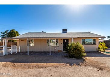 Charming single-story home with a covered porch and xeriscape landscaping at 545 N 98Th St, Mesa, AZ 85207