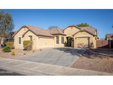 Charming single-story home with a three-car garage, desert landscaping, and neutral-colored exterior at 11910 W Daley Ct, Sun City, AZ 85373