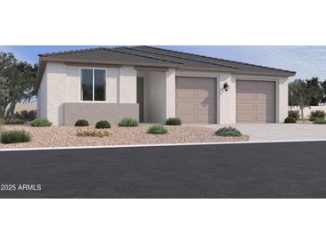 Charming single-story home featuring a two-car garage, neutral color palette, and low maintenance desert landscaping at 15770 W Cheryl Dr, Waddell, AZ 85355