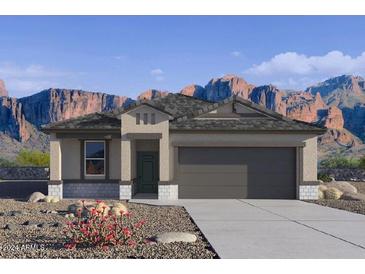 Inviting single-story home featuring a neutral color palette, desert landscaping and a spacious two car garage at 1780 W Sombra Ave, Apache Junction, AZ 85120