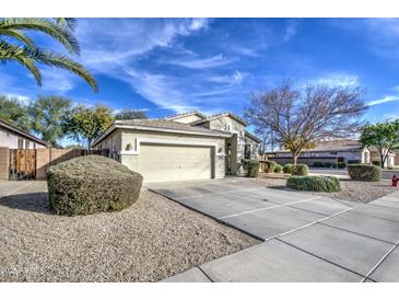 Charming single-Gathering home with a two-car garage, desert landscaping, and a well-maintained front yard at 20477 N 91St Dr, Peoria, AZ 85382