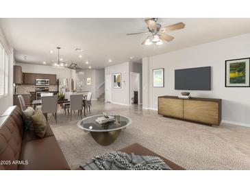 Open-concept living room with a dining area and kitchen, showcasing modern furnishings and neutral tones at 22905 N 19Th Way, Phoenix, AZ 85024