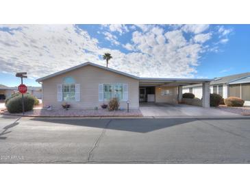 Charming single-story home with a covered carport and well-maintained landscaping in a pleasant residential area at 2550 E Ellsworth Rd # 791, Mesa, AZ 85209