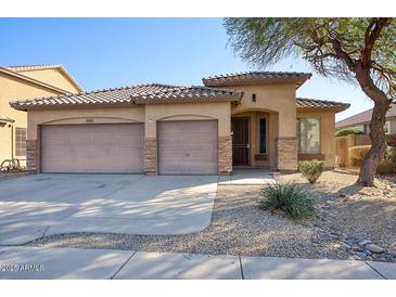 Charming single-story home featuring a two-car garage, desert landscaping, and a welcoming front entrance at 6109 S 30Th Dr, Phoenix, AZ 85041