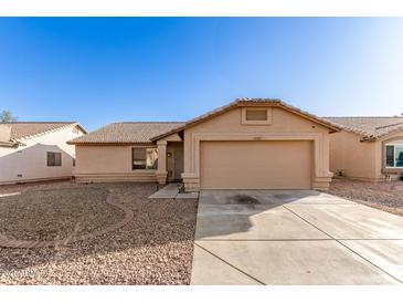 Charming single-story home featuring a two-car garage, low maintenance landscaping, and a classic Southwestern design at 10307 W Windsor Blvd, Glendale, AZ 85307